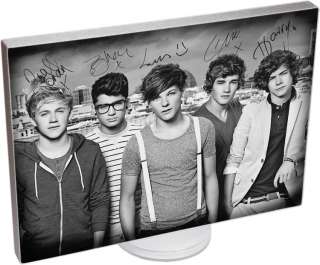   Direction Signed Canvas mounted on a display with stand. 1D Autographs