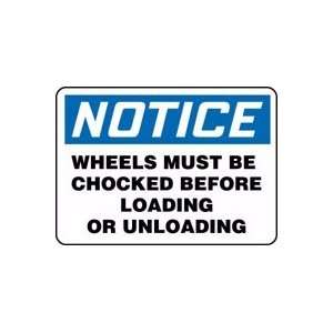  NOTICE WHEELS MUST BE CHOCKED BEFORE LOADING OR UNLOADING 