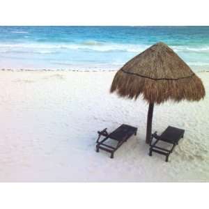 Palm Frond Umbrella and Two Chairs on a White Sand Beach National 