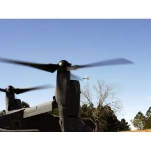 CV 22 Osprey Prepares to Take Off as an A 10 Thunderbolt II Flies 