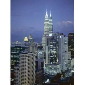 with the Twin Towers of the Petronas Building, Kuala Lumpur, Malaysia 