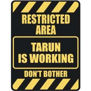   RESTRICTED AREA TARUN IS WORKING  PARKING SIGN