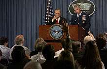 during a Pentagon press briefing. Rumsfeld and General Richard Myers 