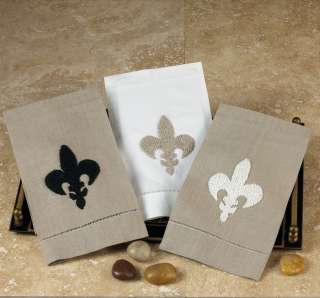   , hand embroidered and hemstitched fleur de lis design towel that