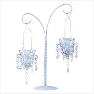   boasts two hanging votive chandeliers glittering crystals and curving