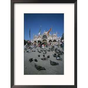  Tourists Feed the Pigeons in Saint Marks Square in Venice 